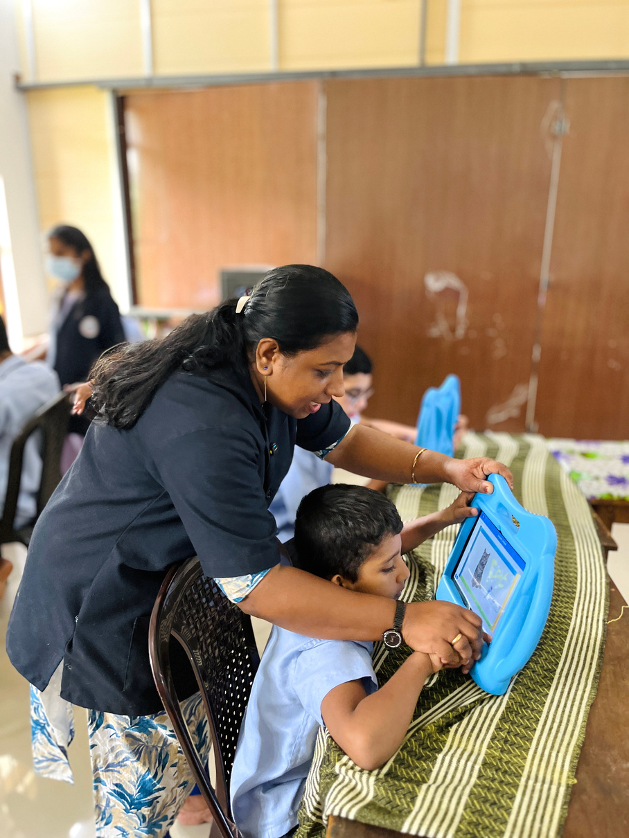 An educator guiding a learner during a DESS activity